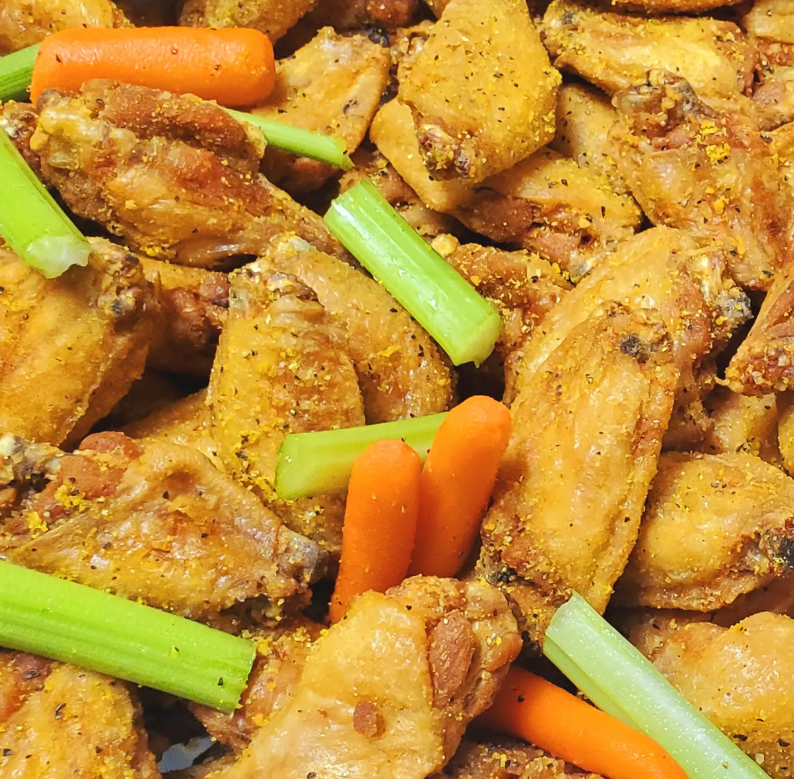 20240914_150556 A close up of chicken wings and carrots